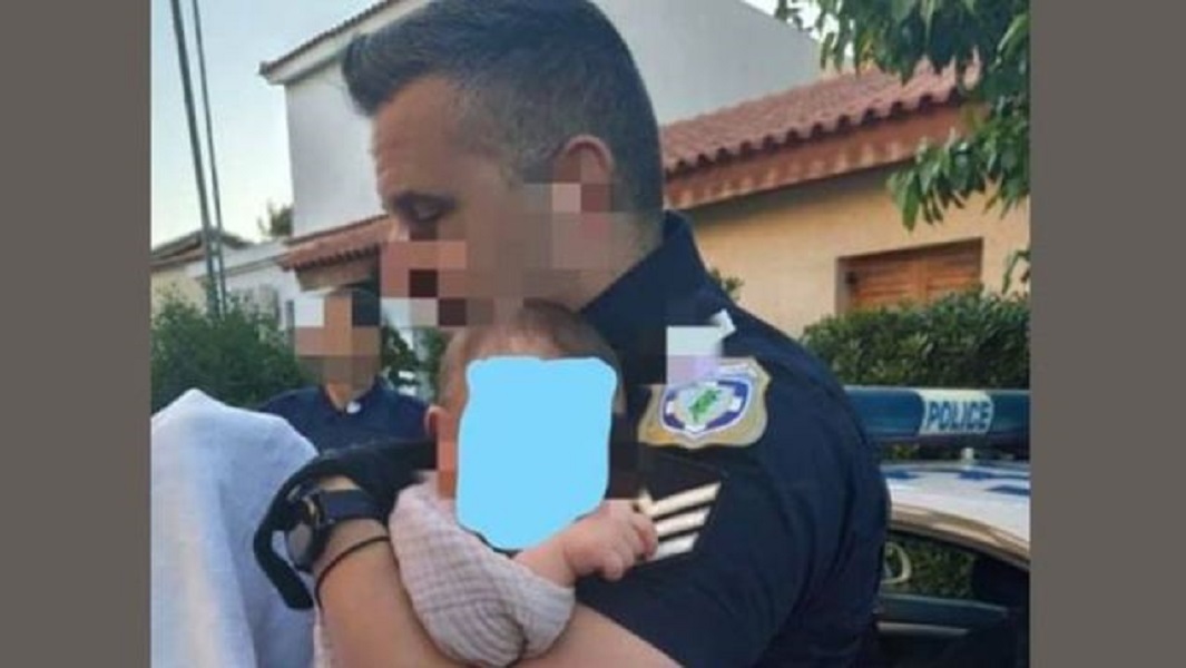 Γλυκά Νερά: Η φωτογραφία με τον αστυνομικό και το μωρό που κάνει τον γύρο του διαδικτύου